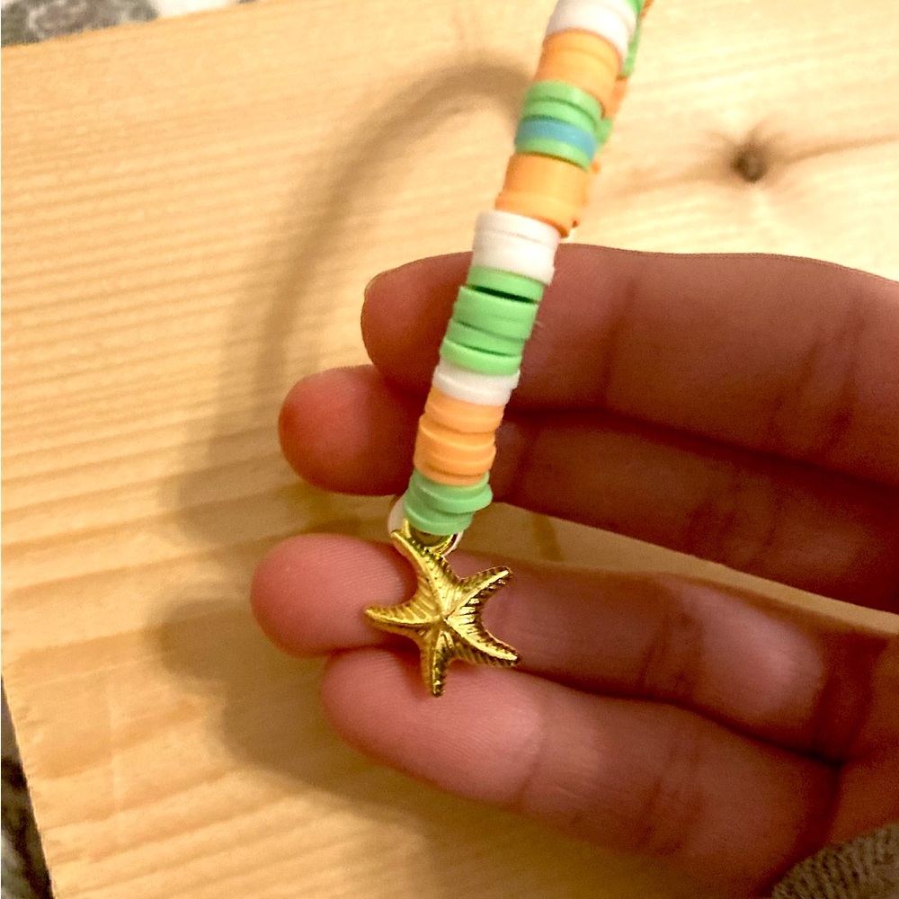 Green white orange beaded bracelet